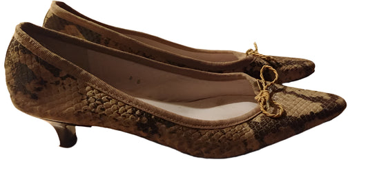 Pair of brown snakeskin-patterned high-heeled shoes on a light surface.